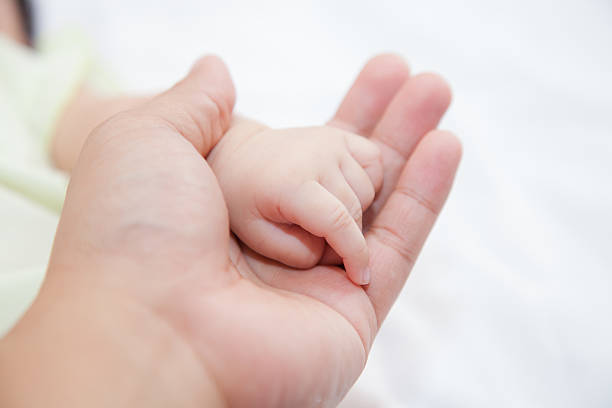 istock Hand of baby 493280212