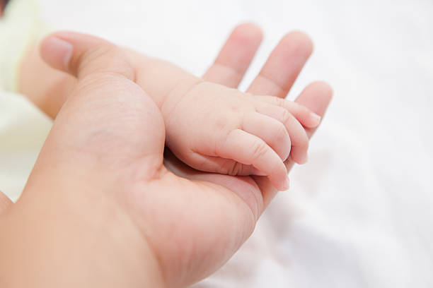 istock Hand of baby 493280378