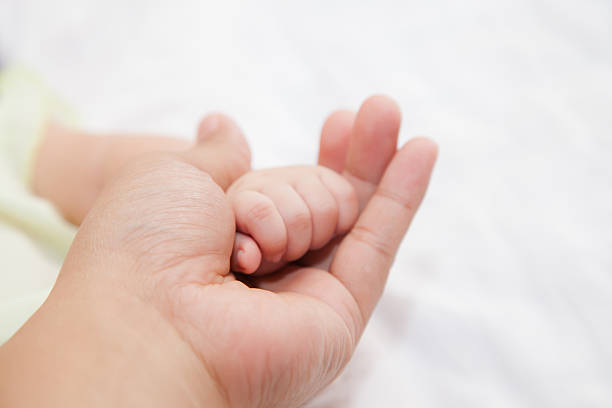 istock Hand of baby 493280438