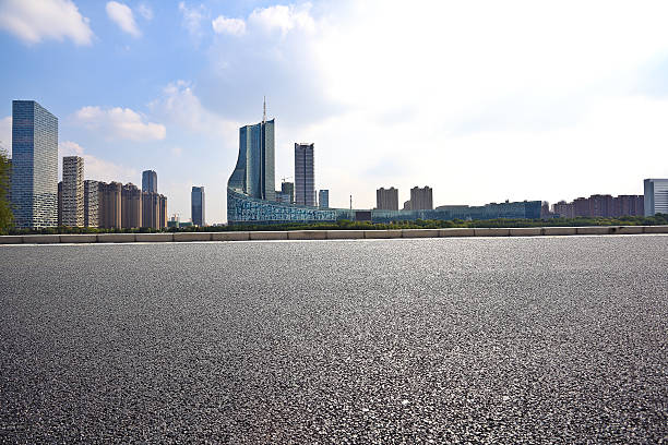 istock Empty road floor with City building background 493280482