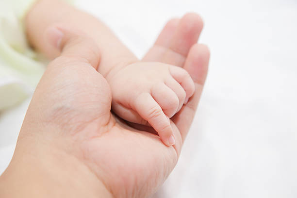 istock Hand of baby 493280612