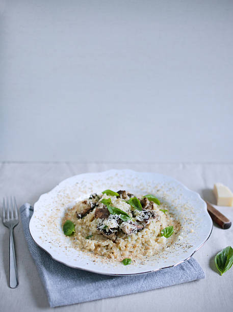 istock Mushroom and foie gras risotto arborio rice with basil 493281004