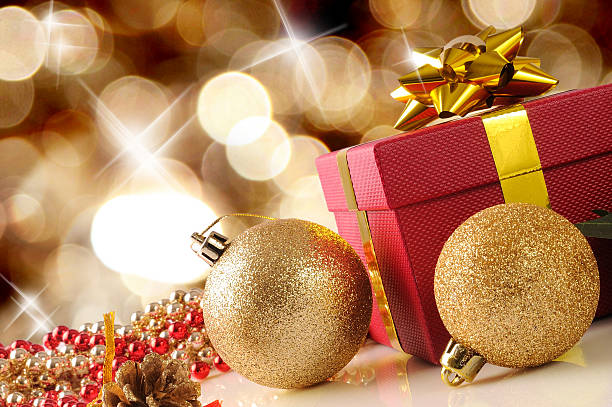 istock Golden Christmas decoration with two balls and gift Diagonal com 493281520