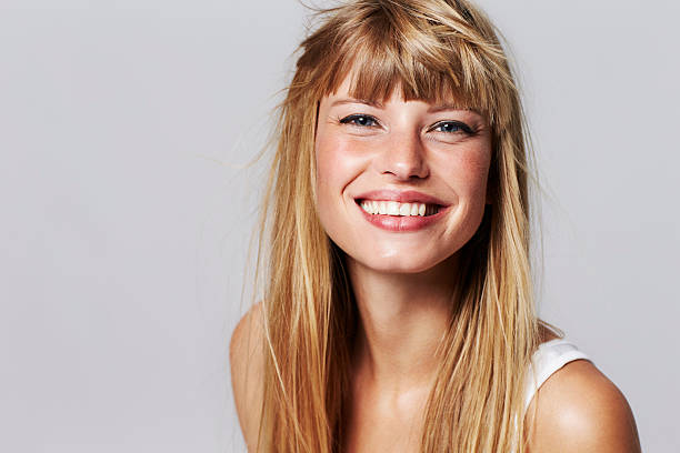 istock Lovely young woman smiling in studio 493282566