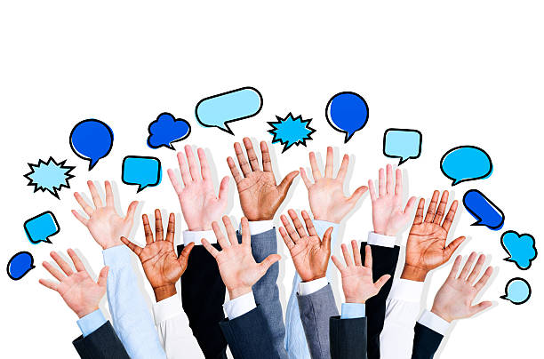 istock Business People's Hands Raised with Speech Bubble 493282695