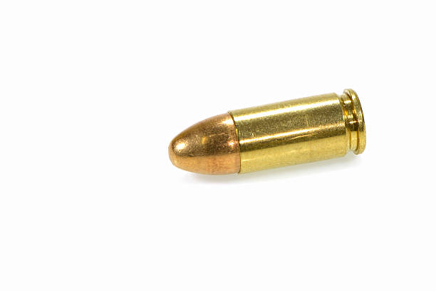 istock 9mm bullet for a gun isolated on a white background 493282717