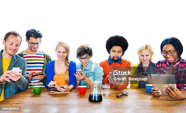 Group Of Multiethnic People Using Digital Devices Stock Photo - Download Image Now - Multiracial Group, Teamwork, Variation