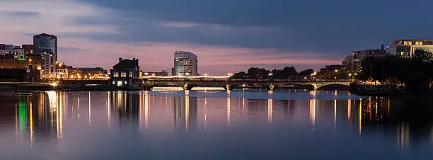 A panorama shot of Limerick Skyline at dusk from the castle area looking down the river