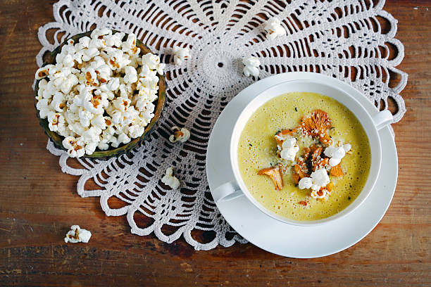 istock Creamy chanterelle mushroom soup, corn chowder and popcorn 493283678