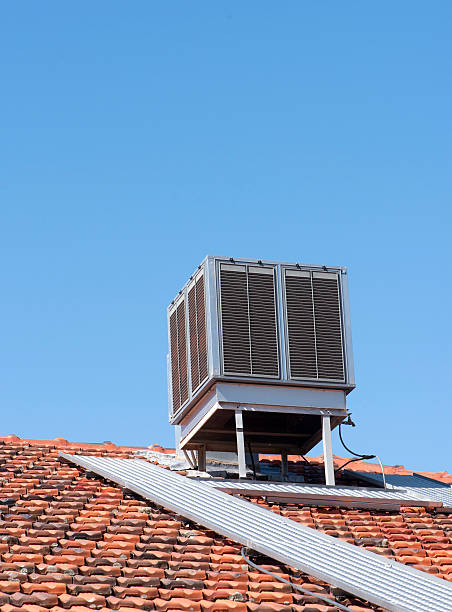 Air conditioner Air conditioner on tiled rooftop energy fuel and power generation city urban scene stock pictures, royalty-free photos & images