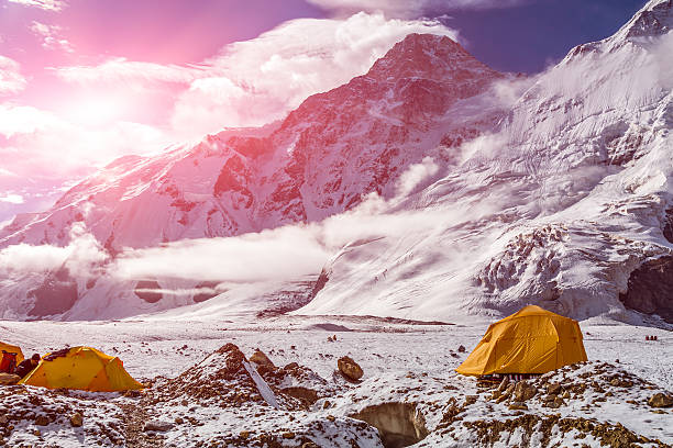 istock High Altitude Mountains and Orange Tents 493302472