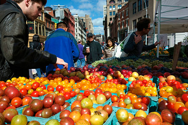 Organic Market New York City, USA - October 7, 2015: people shopping at organic open air market in Union Square union square new york city stock pictures, royalty-free photos & images