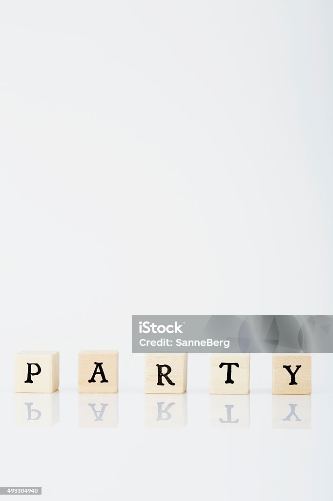 Scrabble tiles spell 'Party' in white studio Letter - Document Stock Photo