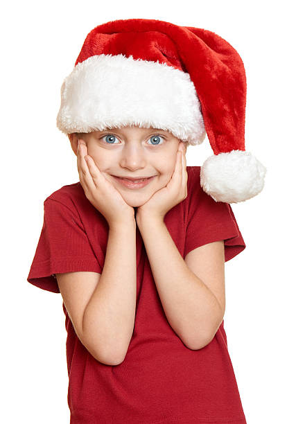istock girl in red santa hat on white isolated 493305606