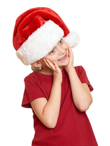 istock girl in red santa hat on white isolated 493305634