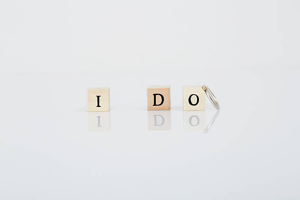 istock Letter tiles say 'I Do' next to wedding ring 493306684