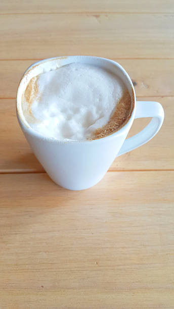 istock Cup of Coffee on wood table background, selctive focus 493306700