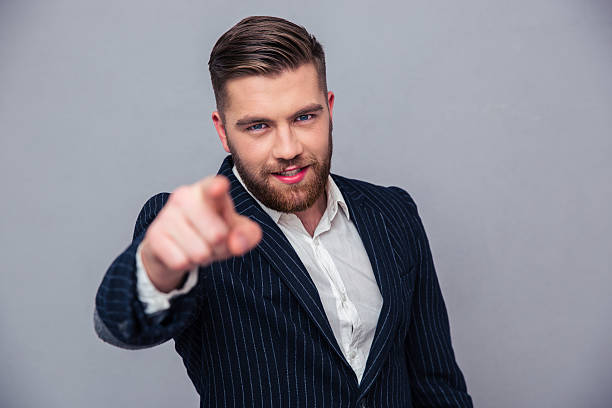 istock Handsome businessman pointing finger at camera 493307978