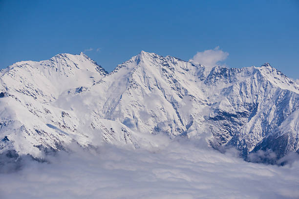 istock View on mountains and blue sky above clouds, Krasnaya Polyana 493310902