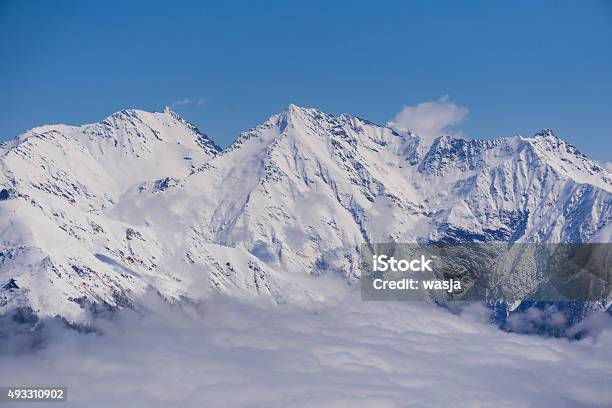 View On Mountains And Blue Sky Above Clouds Krasnaya Polyana Stock Photo - Download Image Now