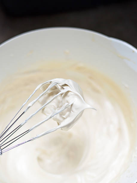 istock Whipping cream with a whisk 493311978