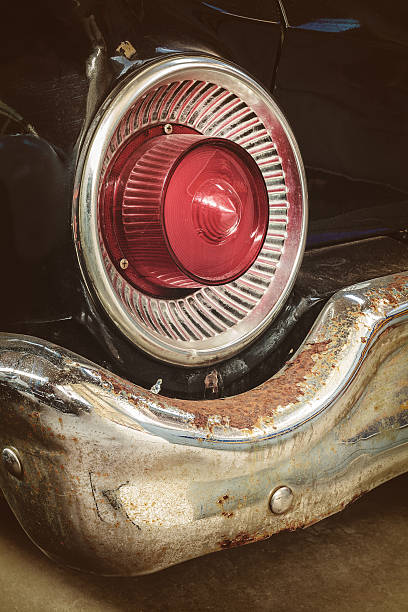 istock Rusted rear light and bumper of a classic car 493313920