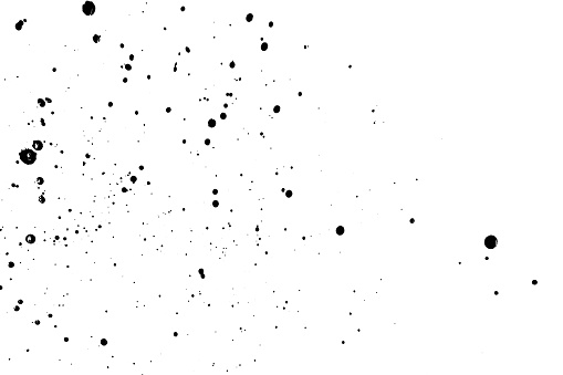 Splattered of black ink drops isolated on white background