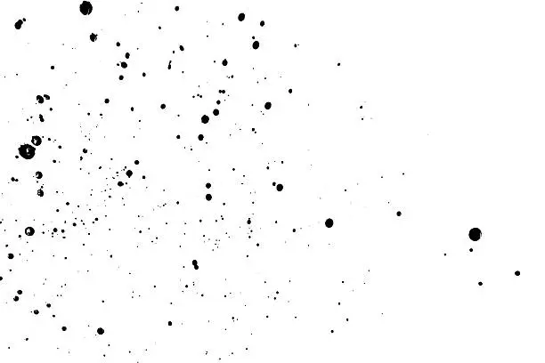 Photo of Splattered of black ink drops isolated on white background