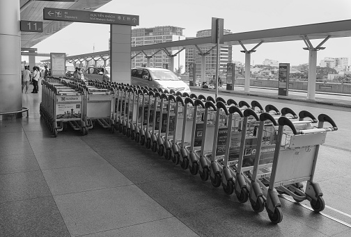 Ho Chi Minh City, Vietnam - March 8, 2015: View of the departure hall with luggage carts in Tan Son Nhat International Airport. Tan Son Nhat is the lagest airport located in Ho Chi Minh City, Vietnam.