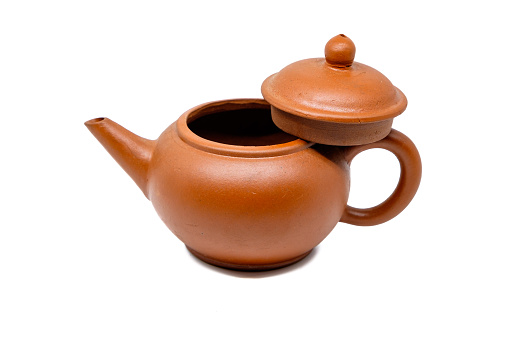 Close up of brown teapot isolated on white