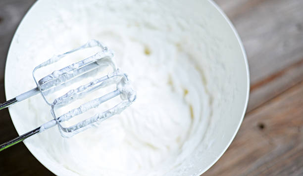 istock Whipped egg whites for cream on wooden table 493315642