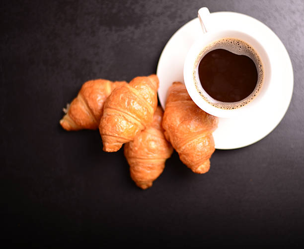 istock Breakfast with coffee and croissants. 493317538