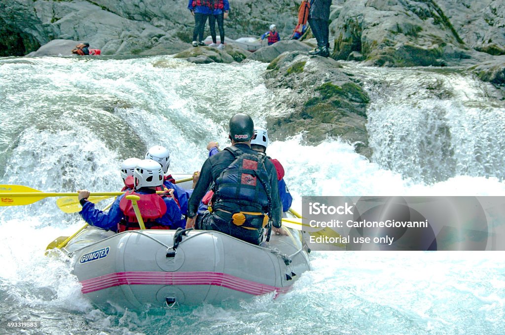 Rafting Varallo Sesia, Italy - September 4, 2010: A group of men & women a rafting center down the Sesia river in Italy Activity Stock Photo