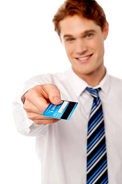 istock Corporate man offering you credit card 493319867