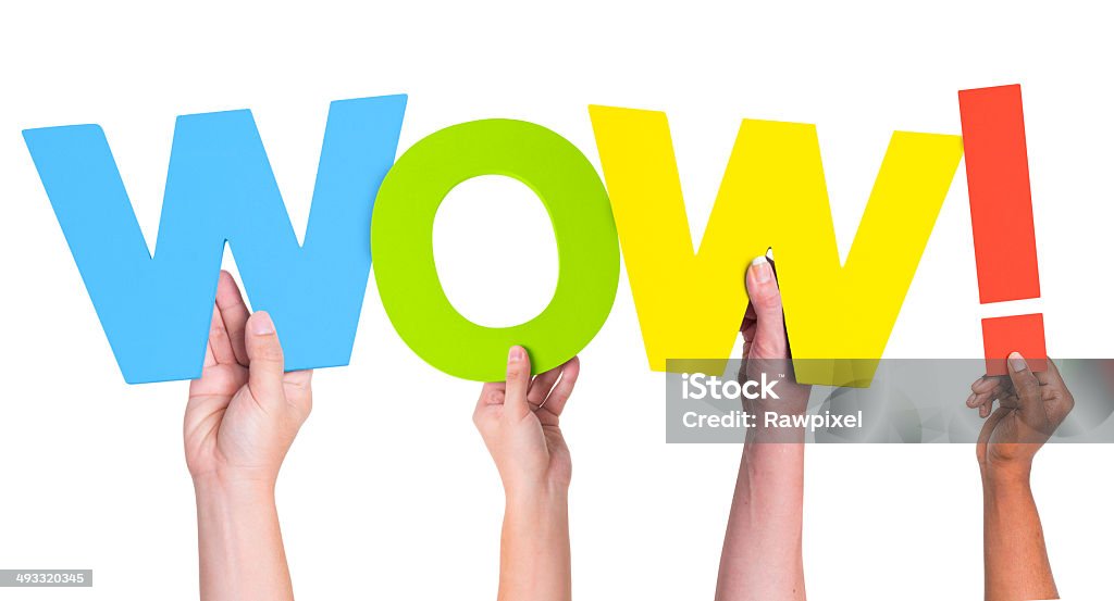 Multiethnic Hands Holding Text Wow with Exclamation Point Awe Stock Photo