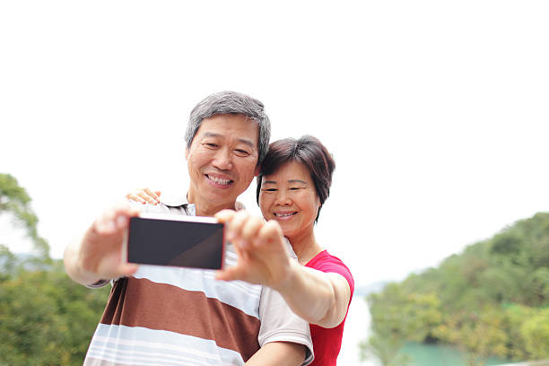 istock Senior happy couple taking a selfie 493321077