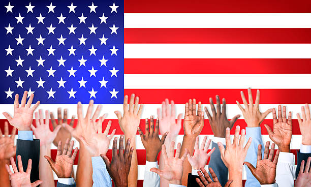istock Group Of Multiethnic Arms Outstretched With North American Flag 493321897