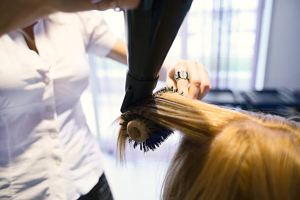 istock Drying hair in hair salon. 493323479