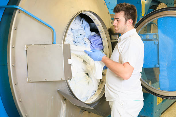 istock Laundry Washer Hospital - Put on Machine 493324041