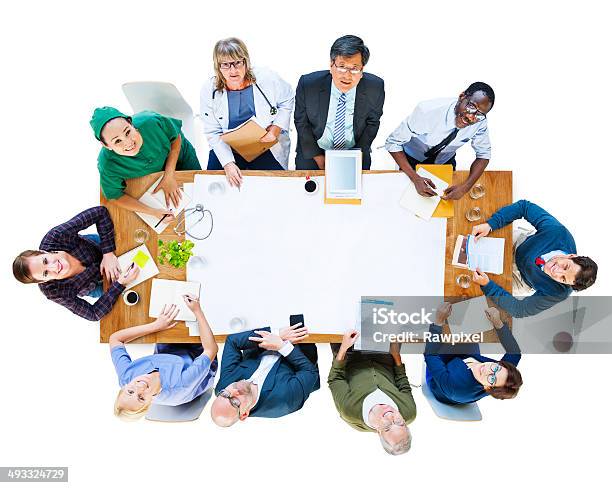 Group Of People With Various Occupations In A Meeting Stock Photo - Download Image Now