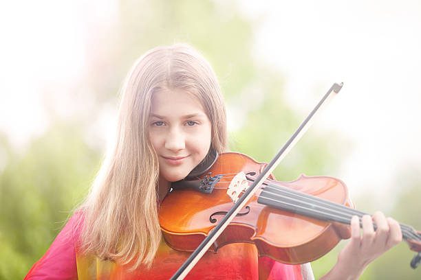 istock Young Girl Viola Player Outdoors 493325125