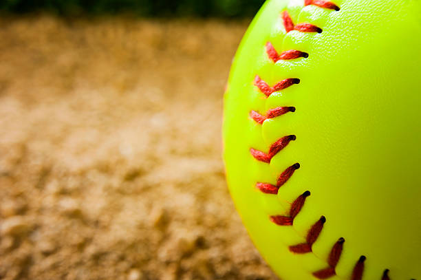 softball close-up - softball playing field fluorescent team sport - fotografias e filmes do acervo