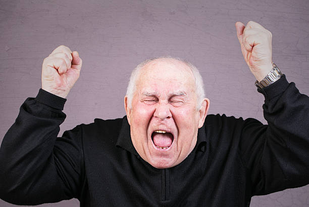 istock Very emotional old man screams in grief. 493329236