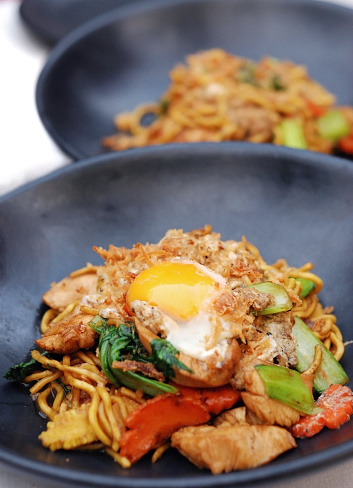 Selective focus of Fry noodle with chicken and egg, Chinese Hokkien style