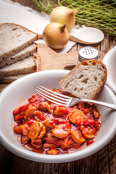 istock Lecho - stew with peppers, onions and sausages. 493330392