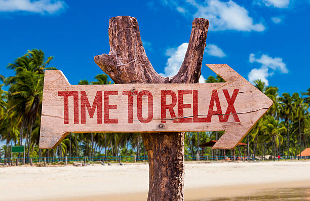 istock Time to Relax arrow with beach background 493332470