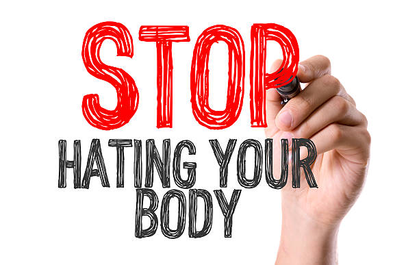 istock Hand with marker writing the word Stop Hating Your Body 493332796