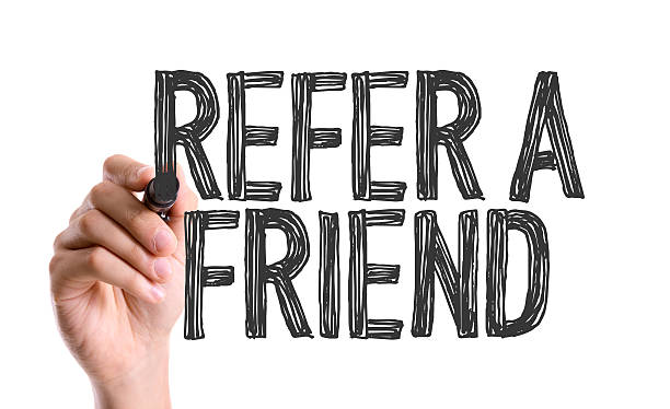 istock Hand with marker writing the word Refer a Friend 493332832
