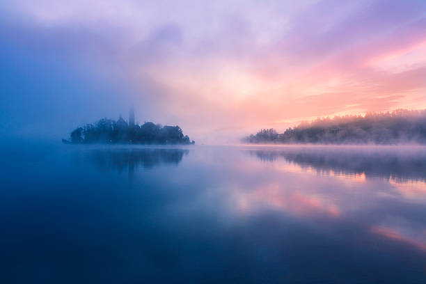Misty morning in lake Bled stock photo