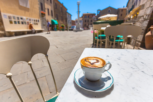 Having a Cup of Cappuccino in an Italian Town